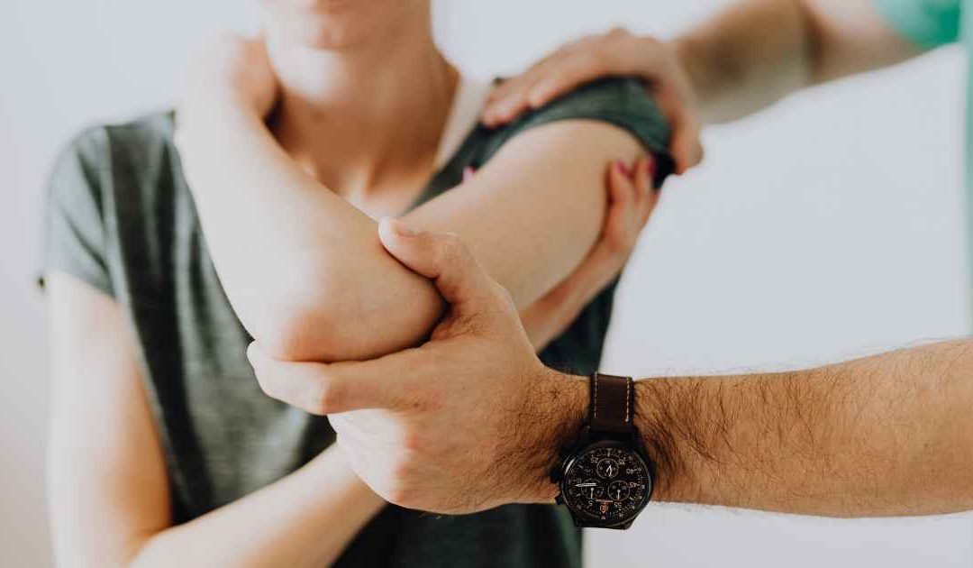 Physician preparing patient for platelet-rich plasma injection for orthopedic joint treatment