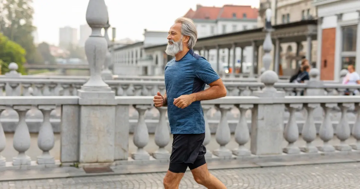 Man running outdoors after recovering from tendon pain, representing improved mobility after shockwave therapy