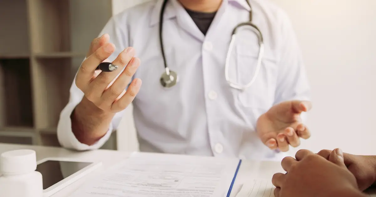 Doctor explaining PRP and A2M treatment options for joint degeneration.